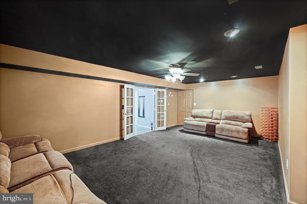 13710 Baden Naylor Road Upper Marlboro, MD 20772 - Photo 49 of 66 a spacious bedroom with a bed and a couch