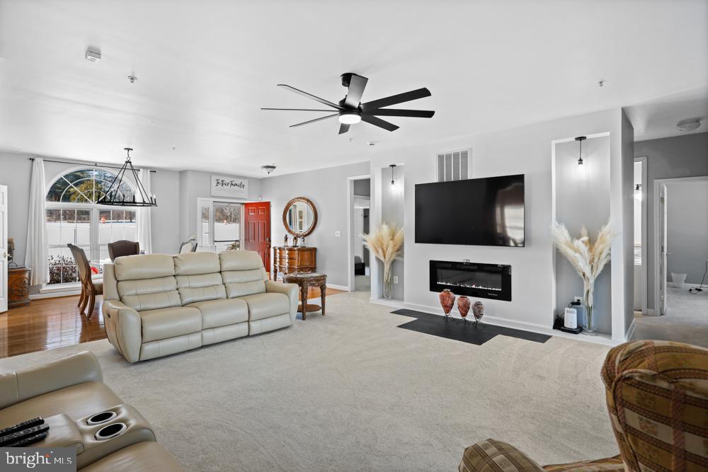 13710 Baden Naylor Road Upper Marlboro, MD 20772 - Photo 9 of 66 a living room with furniture and a flat screen tv