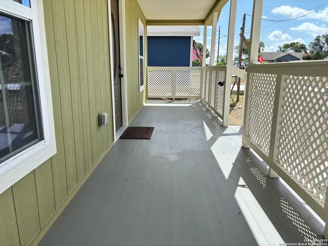 a view of a balcony with door
