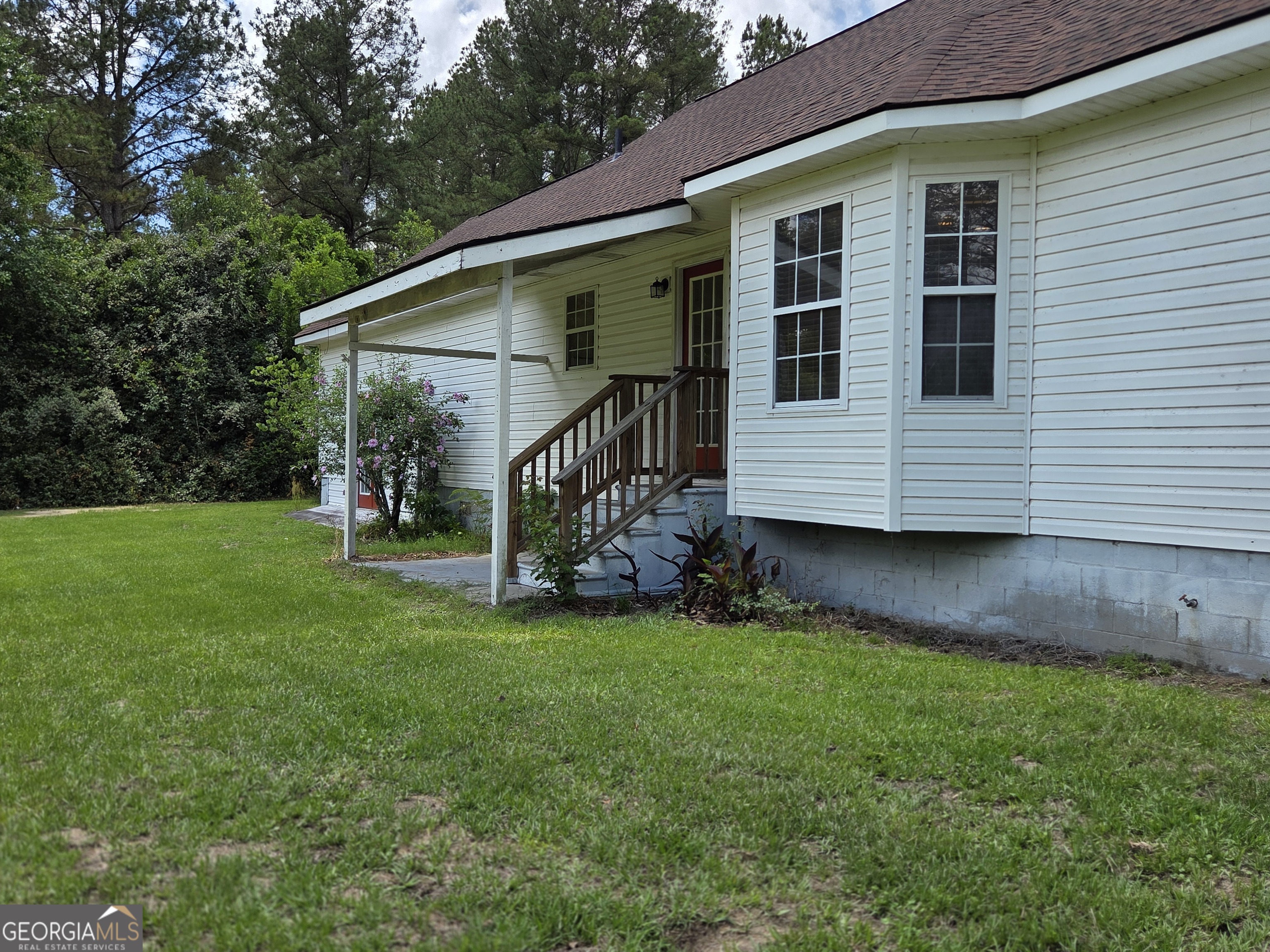 9546 Union Road Metter, GA 30439 - Photo 37 of 45 a view of a house with a yard