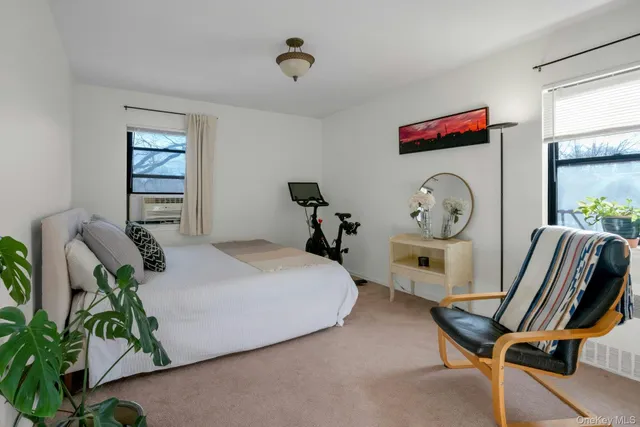 a bed room with furniture and a window