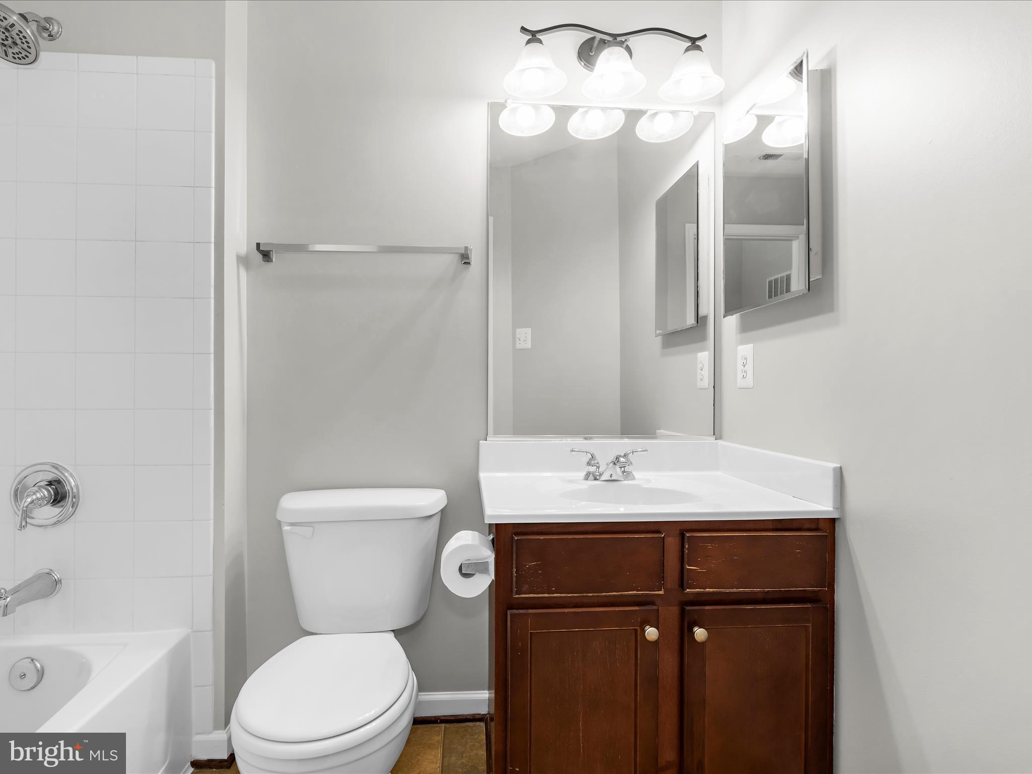 9865 Decatur Road Middle River, MD 21220 - Photo 27 of 63 a bathroom with a sink a toilet and shower
