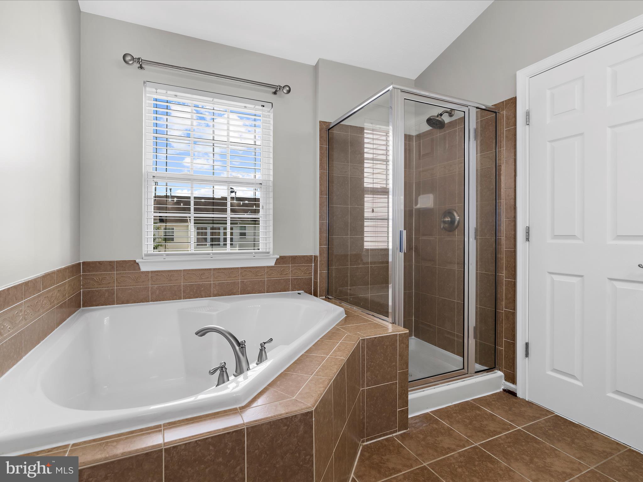 9865 Decatur Road Middle River, MD 21220 - Photo 33 of 63 a bathroom with a bathtub and a shower