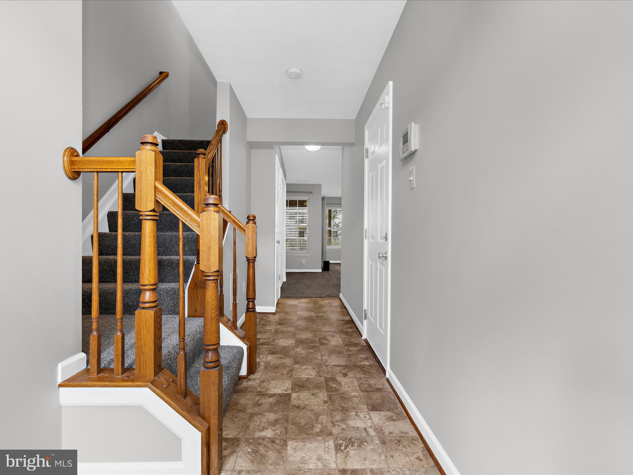 9865 Decatur Road Middle River, MD 21220 - Photo 5 of 63 a view of a hallway with wooden floor and entryway