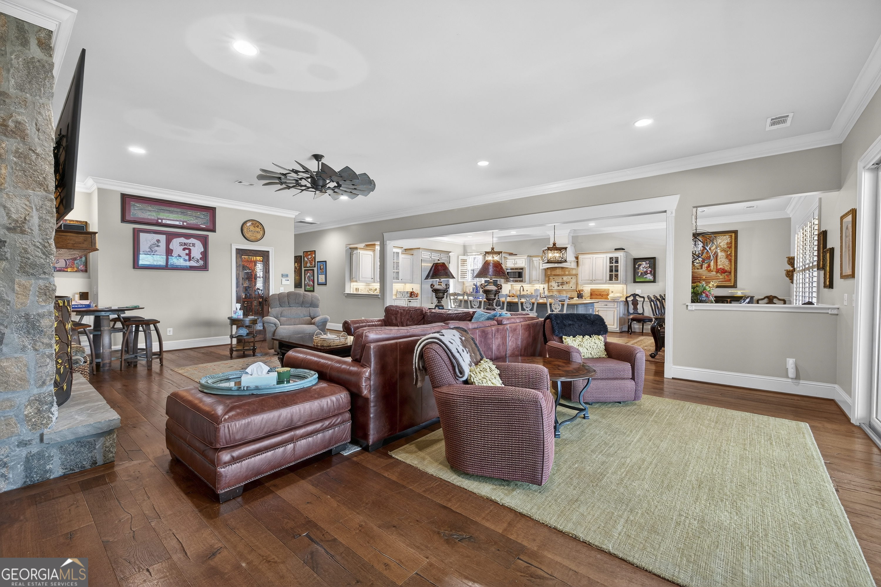 238 Cold Branch Road Eatonton, GA 31024 - Photo 7 of 104 a living room with furniture kitchen view and a wooden floor