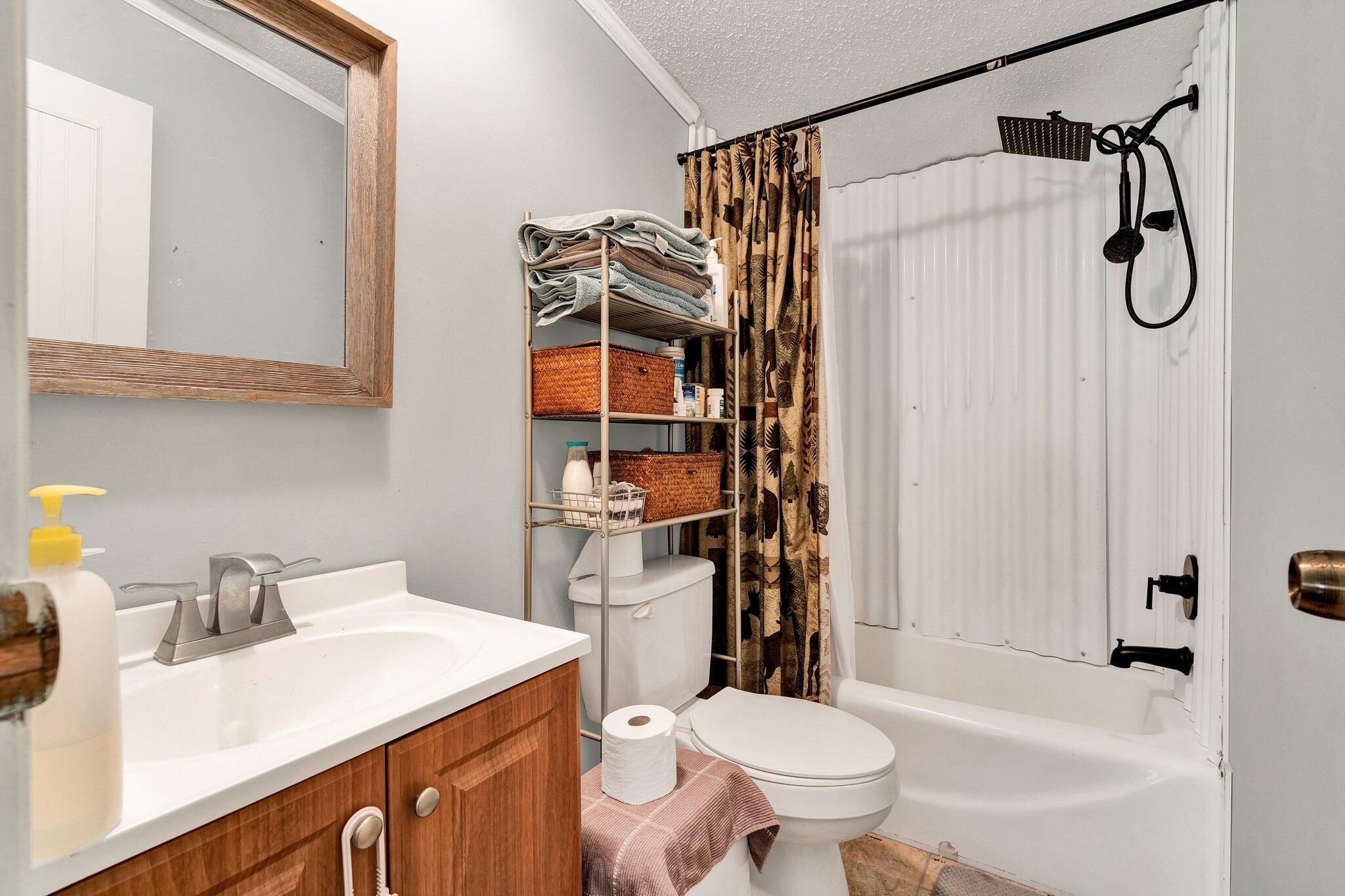 2131 Southeast Hunt Road Cleveland, TN 37323 - Photo 13 of 38 a bathroom with a sink toilet and shower