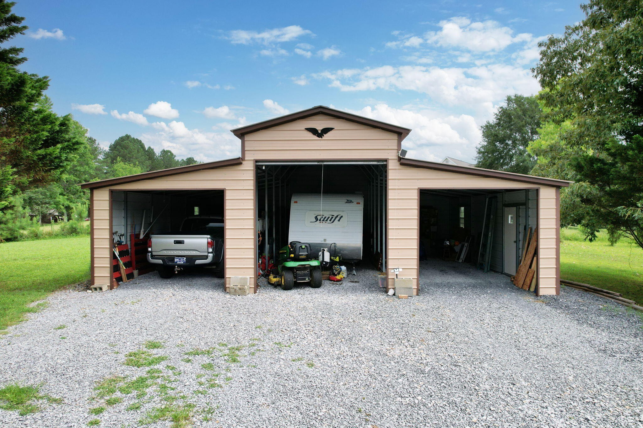 2131 Southeast Hunt Road Cleveland, TN 37323 - Photo 27 of 38 a view of a house with a garage and a yard