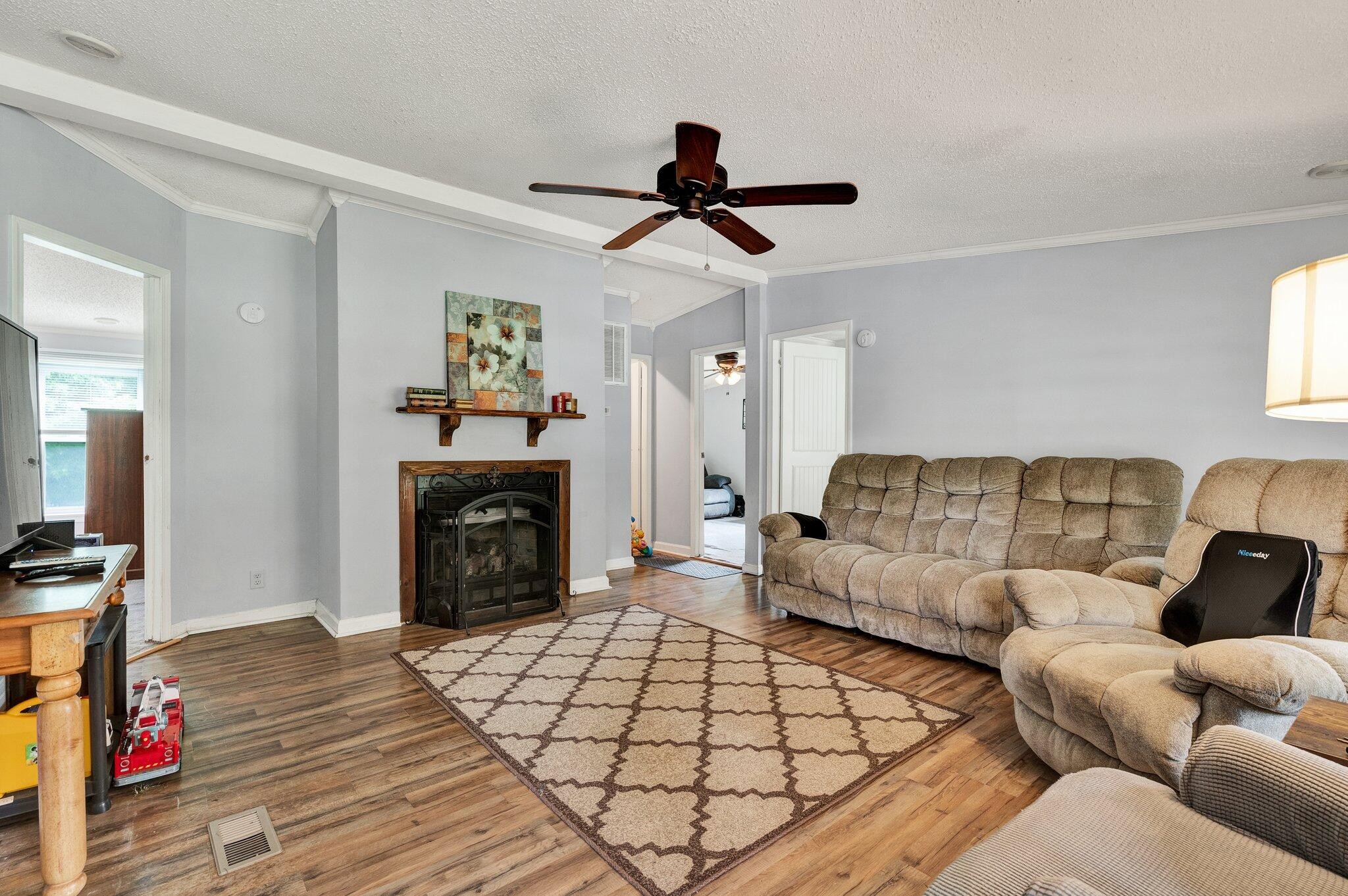 2131 Southeast Hunt Road Cleveland, TN 37323 - Photo 3 of 38 a living room with furniture and a fireplace