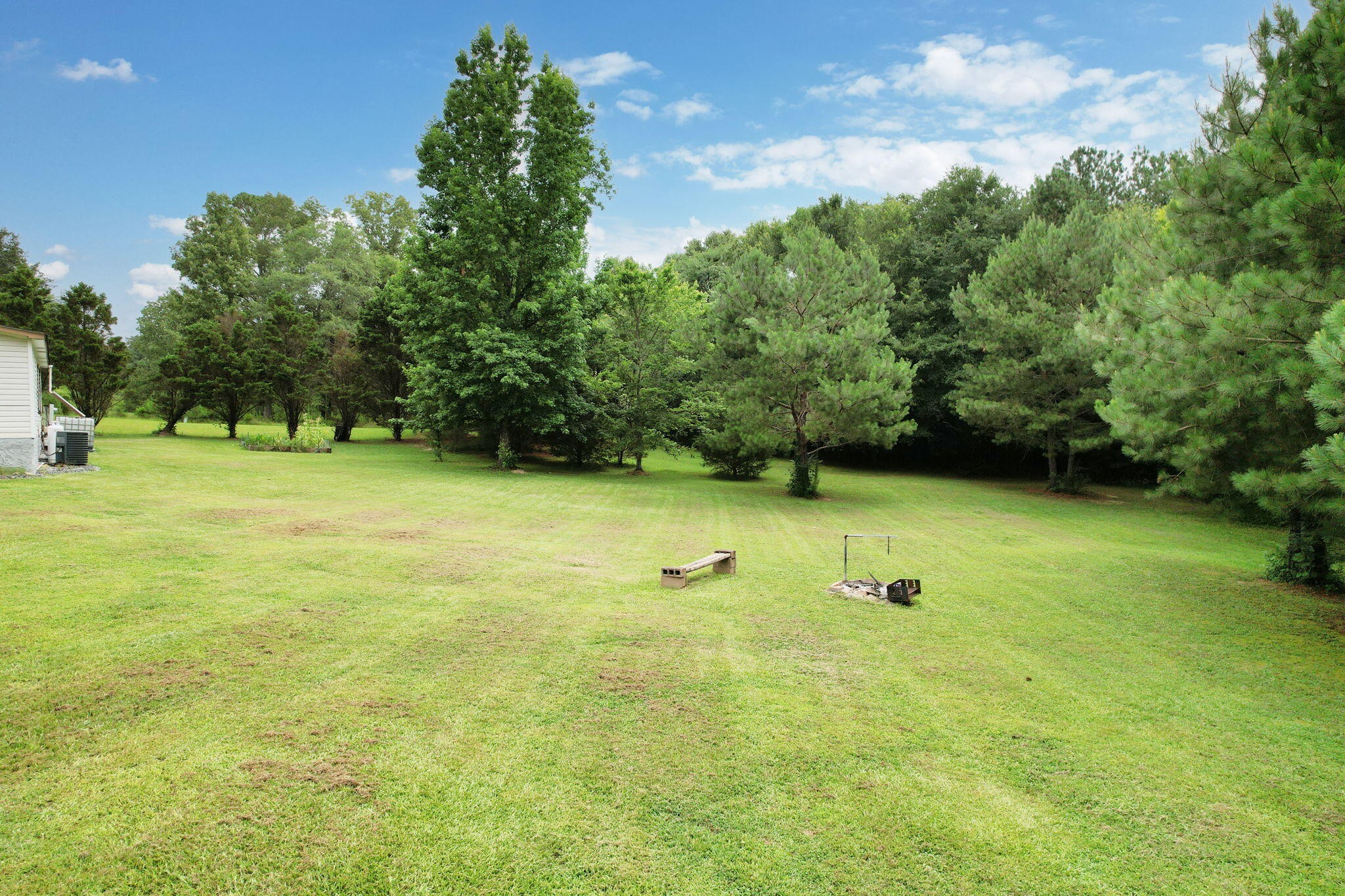 2131 Southeast Hunt Road Cleveland, TN 37323 - Photo 32 of 38 a view of a field with a tree in it