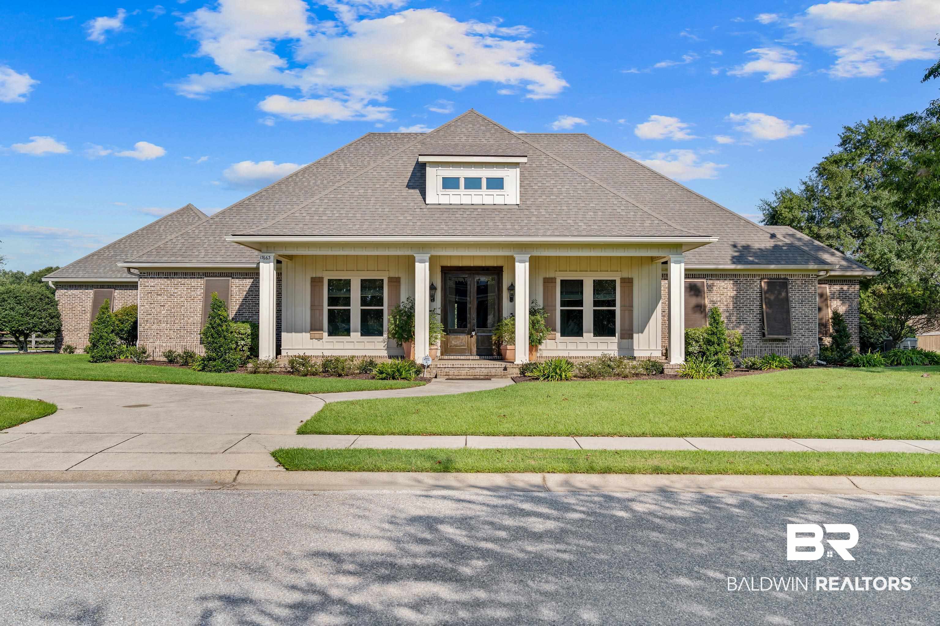17663 Burwick Loop Fairhope, AL 36532 - Photo 1 of 41 View of front of house featuring a porch and a front lawn