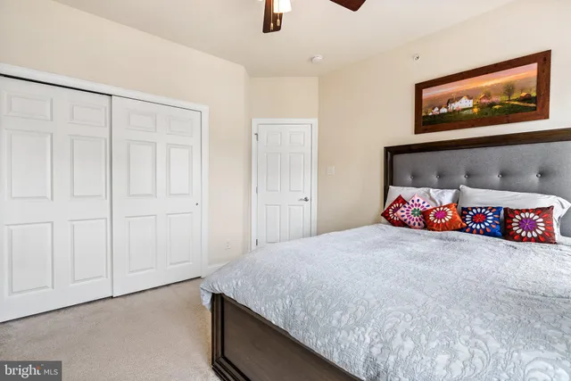 a bedroom with a bed and dresser