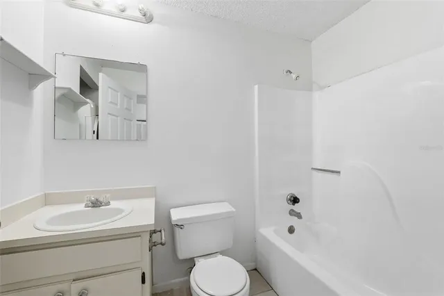 a bathroom with a sink toilet and vanity