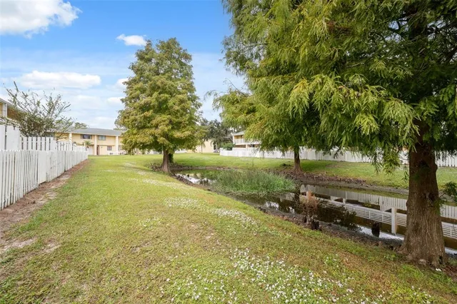 a view of backyard with green space