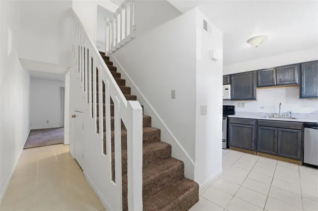 a view of a kitchen from the hallway