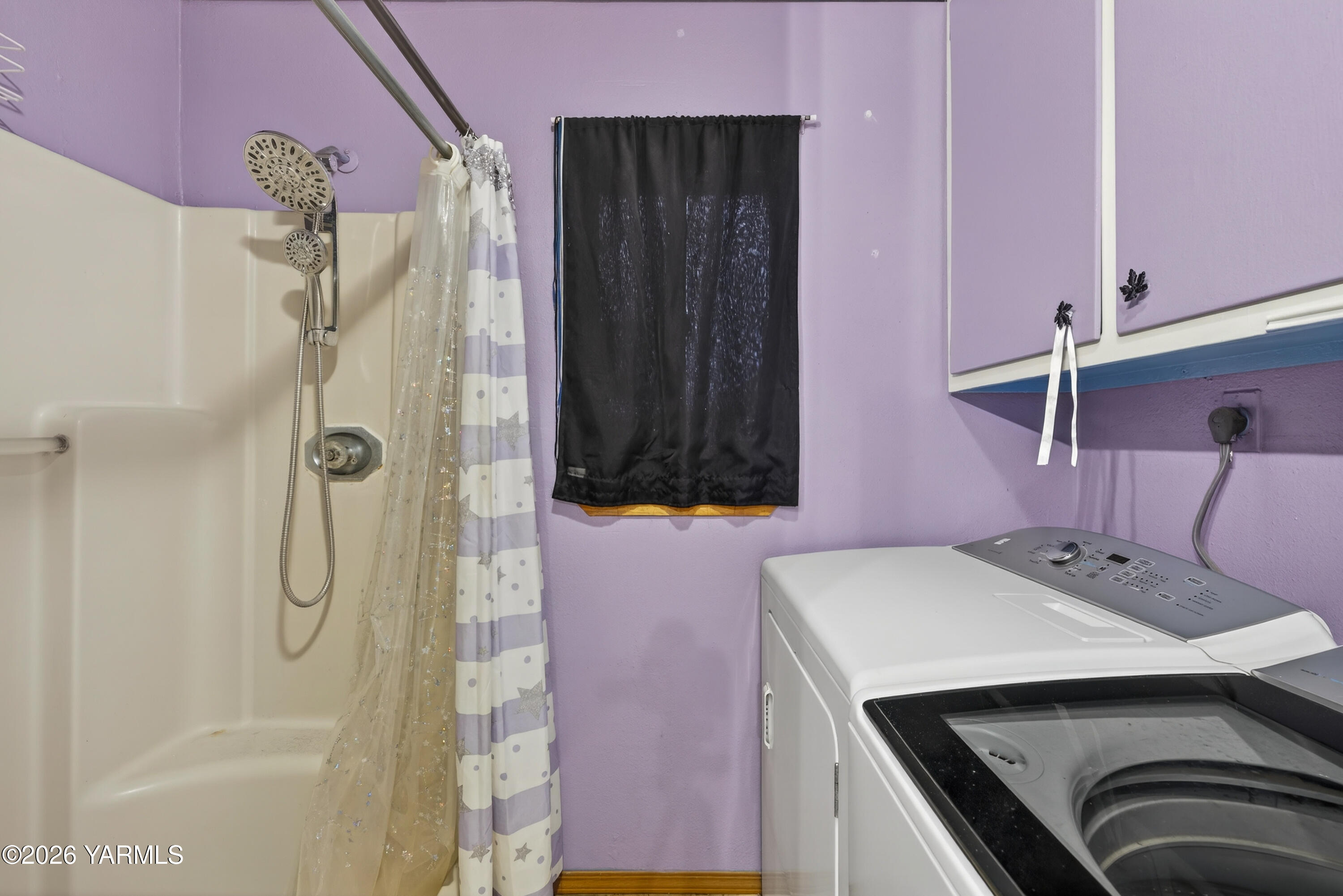 232 6th Avenue Mabton, WA 98935 - Photo 14 of 35 a bathroom with a sink a mirror and shower