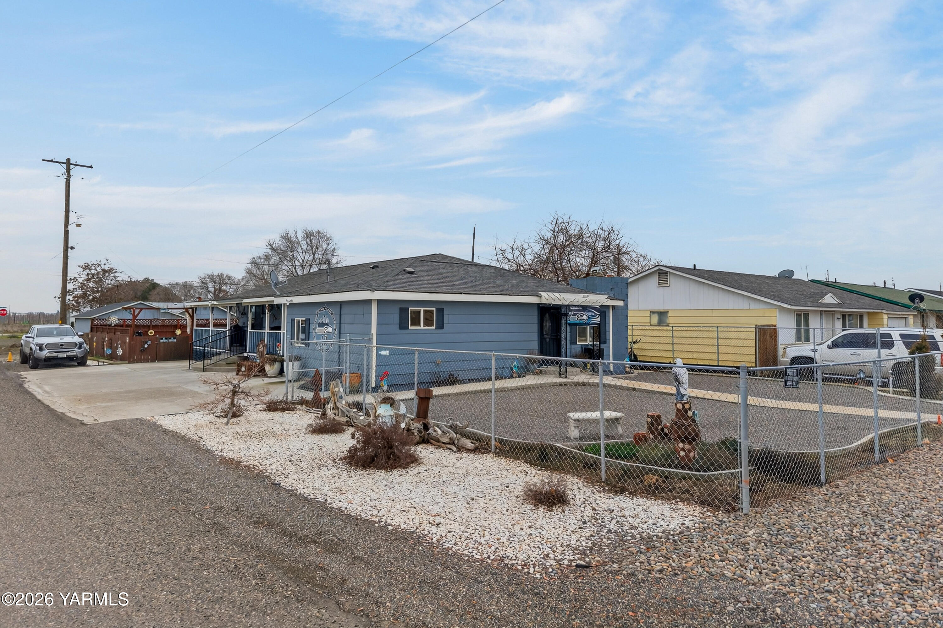 232 6th Avenue Mabton, WA 98935 - Photo 25 of 35 a front view of a house with swimming pool and sitting area