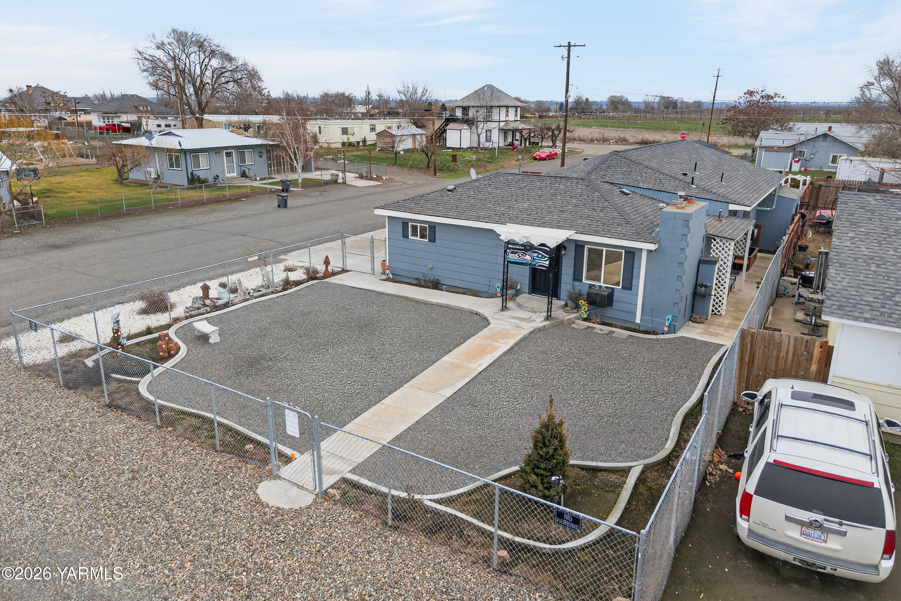 232 6th Avenue Mabton, WA 98935 - Photo 27 of 35 an aerial view of a house with a garden and lake view