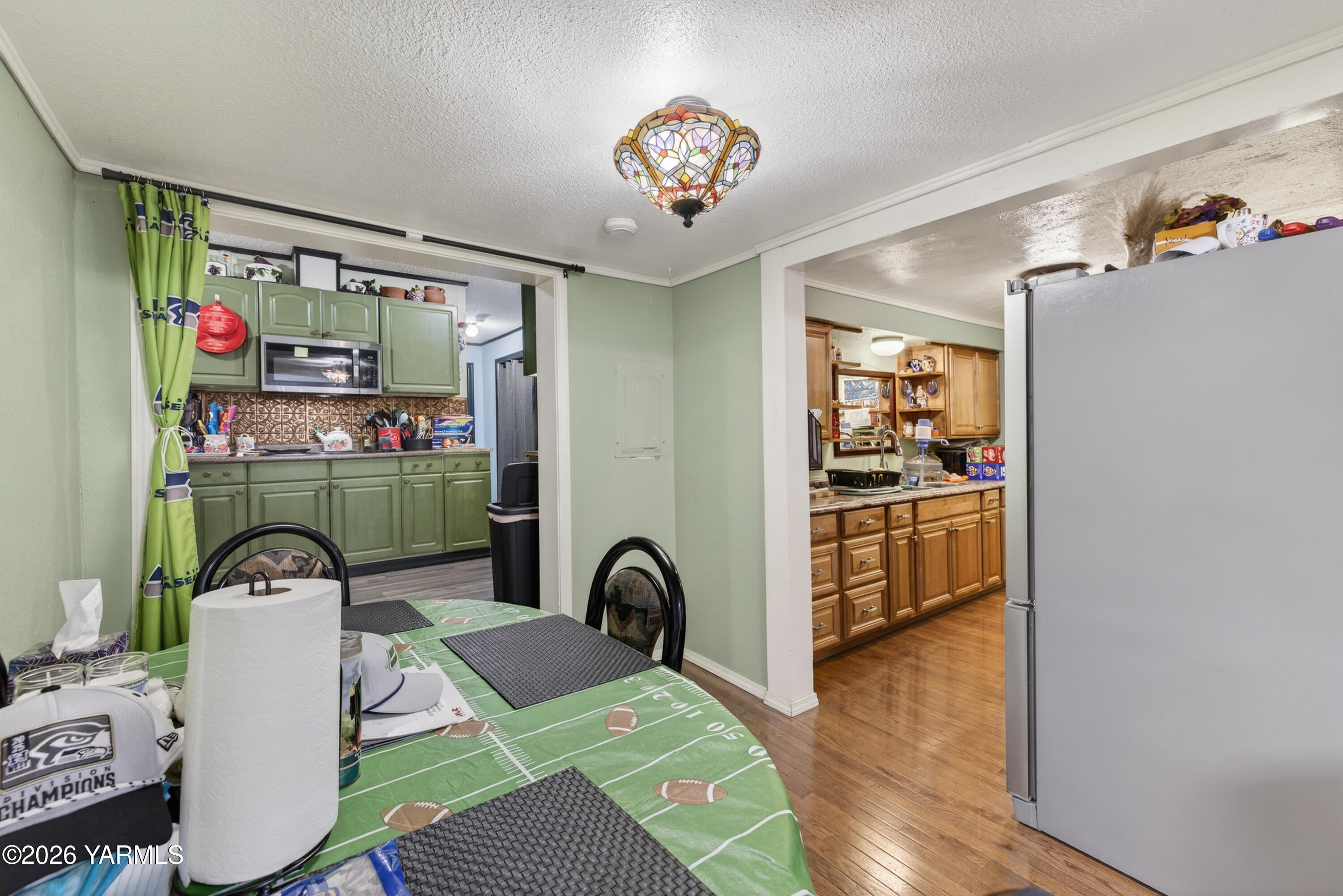 232 6th Avenue Mabton, WA 98935 - Photo 7 of 35 a bedroom with furniture and a chandelier