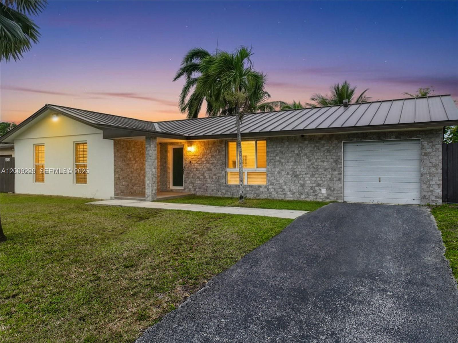 13251 Southwest 254th Terrace Homestead, FL 33032 - Photo 1 of 21 a front view of a house with garden