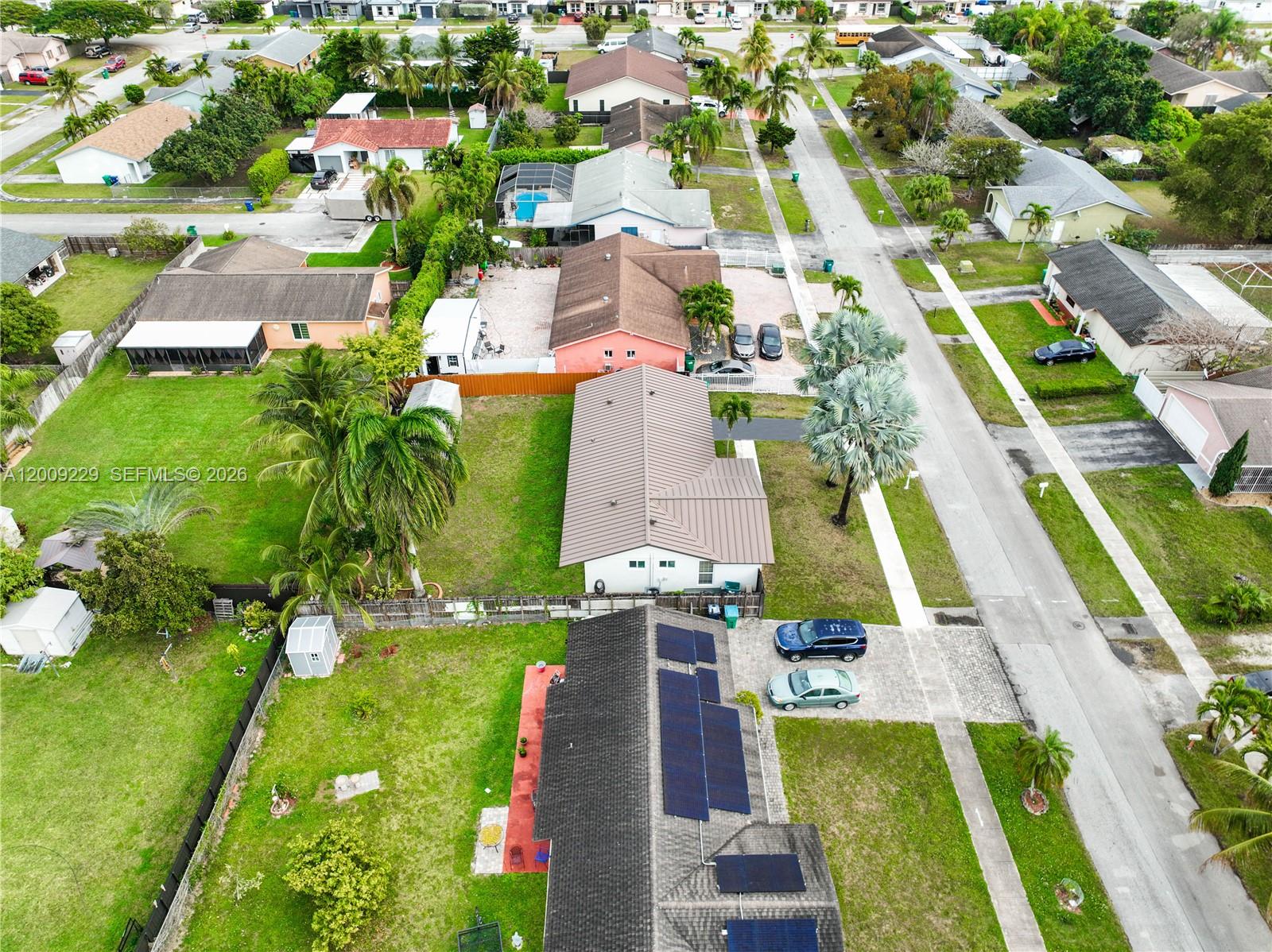 13251 Southwest 254th Terrace Homestead, FL 33032 - Photo 13 of 21 an aerial view of residential houses with outdoor space and swimming pool