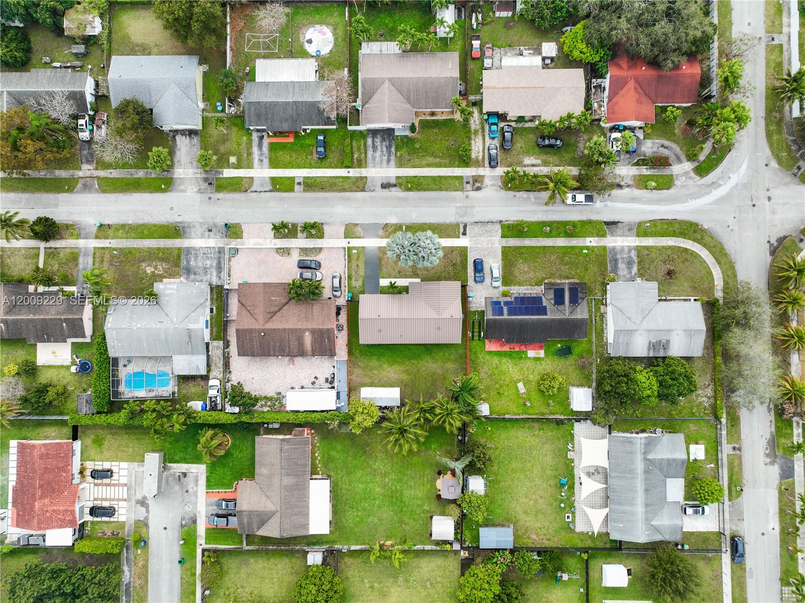 13251 Southwest 254th Terrace Homestead, FL 33032 - Photo 14 of 21 an aerial view of houses with yard