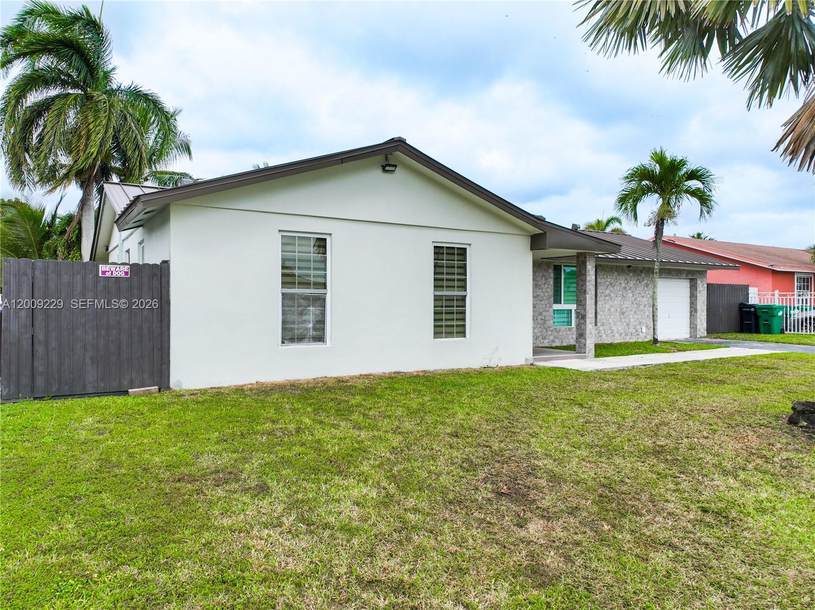 13251 Southwest 254th Terrace Homestead, FL 33032 - Photo 8 of 21 a view of a house with a yard