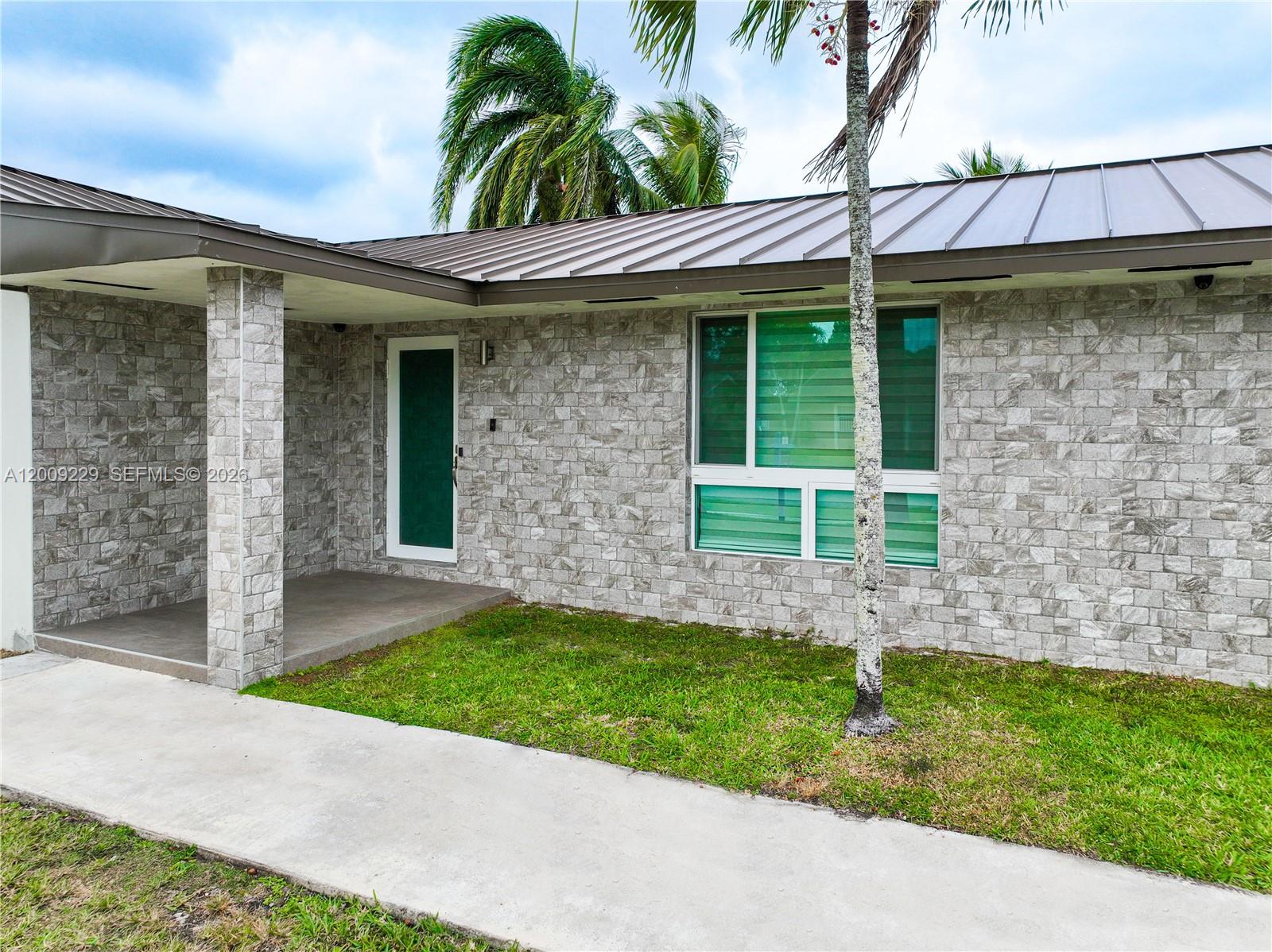 13251 Southwest 254th Terrace Homestead, FL 33032 - Photo 10 of 21 a view of a house with a yard and plants