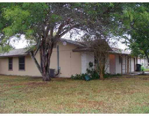 a view of a house with a tree