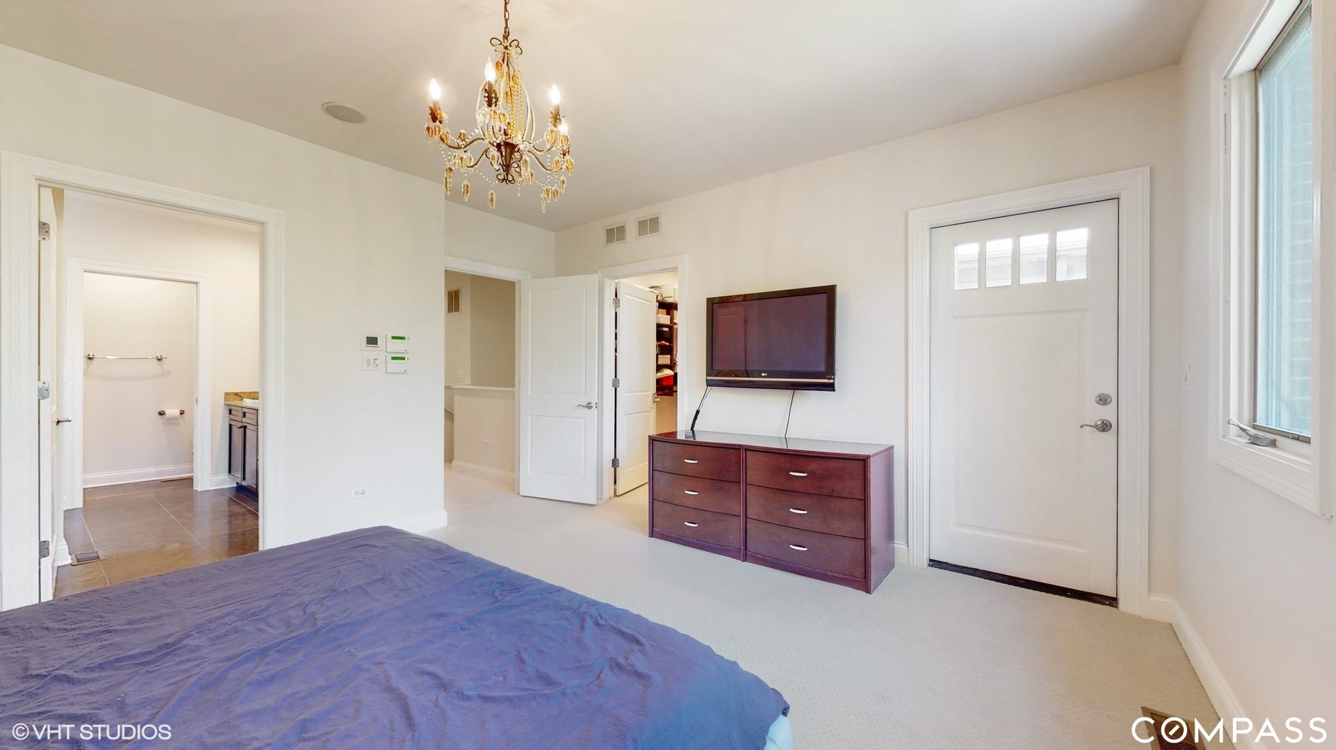 1412 South Emerald Avenue Chicago, IL 60607 - Photo 12 of 33 a bedroom with a bed and a flat screen tv