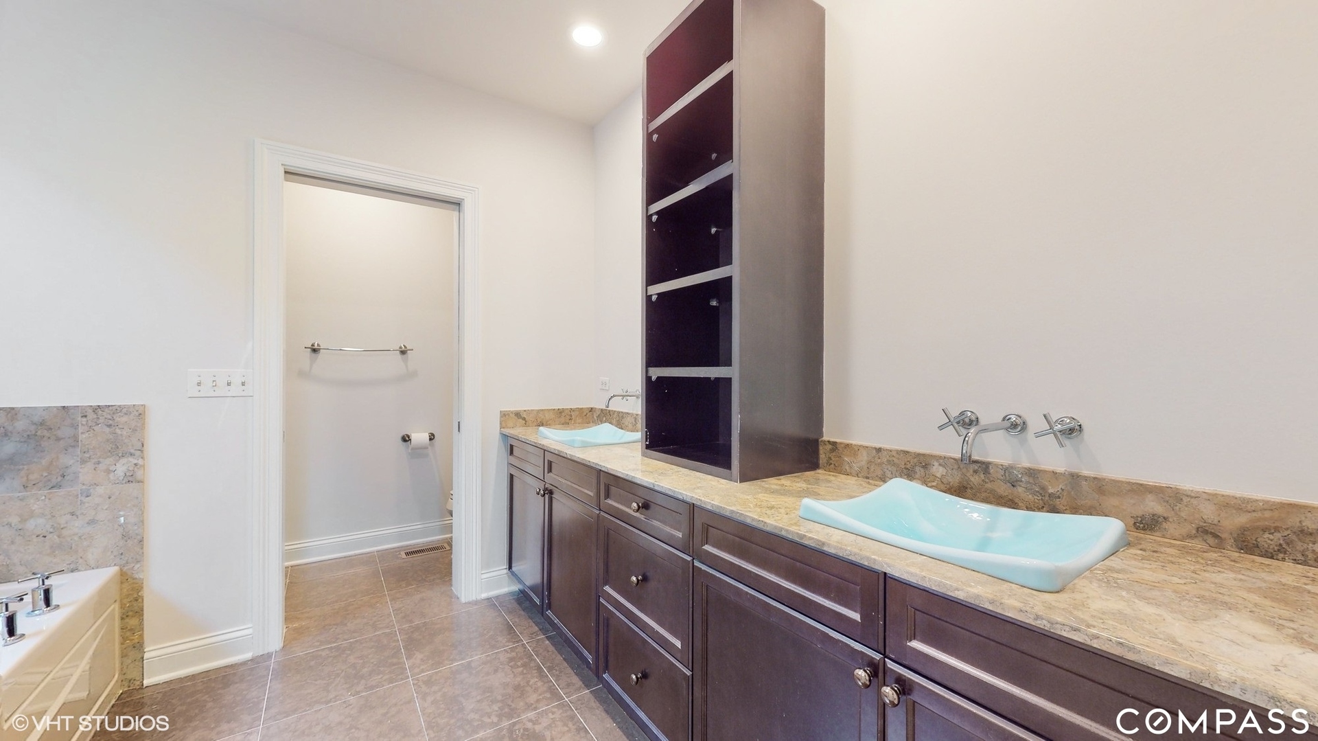 1412 South Emerald Avenue Chicago, IL 60607 - Photo 13 of 33 a bathroom with a granite countertop sink and a mirror