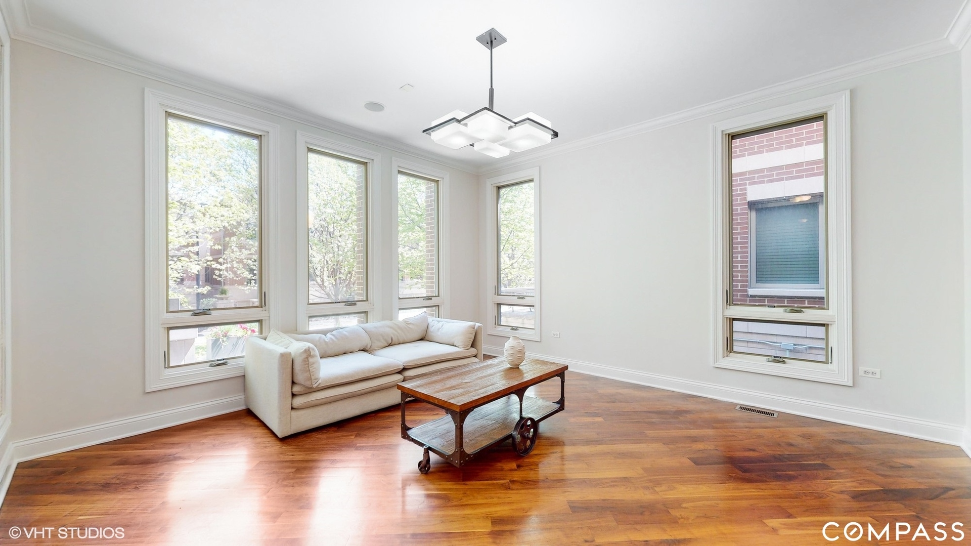 1412 South Emerald Avenue Chicago, IL 60607 - Photo 2 of 33 a living room with furniture and a chandelier