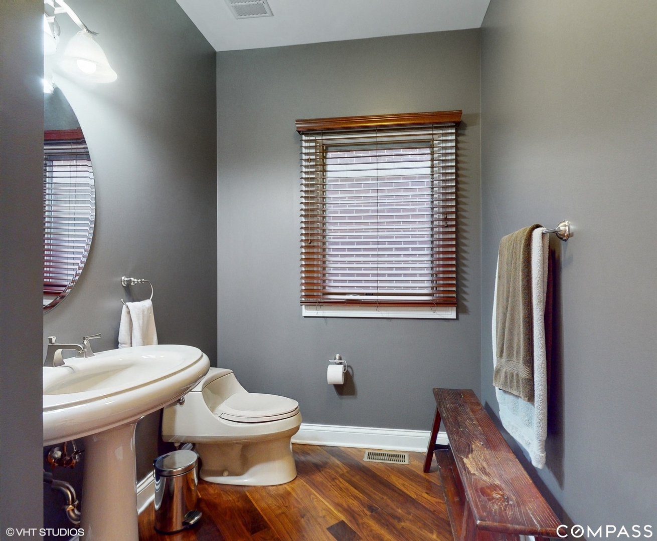 1412 South Emerald Avenue Chicago, IL 60607 - Photo 10 of 33 a bathroom with a toilet a sink and a mirror