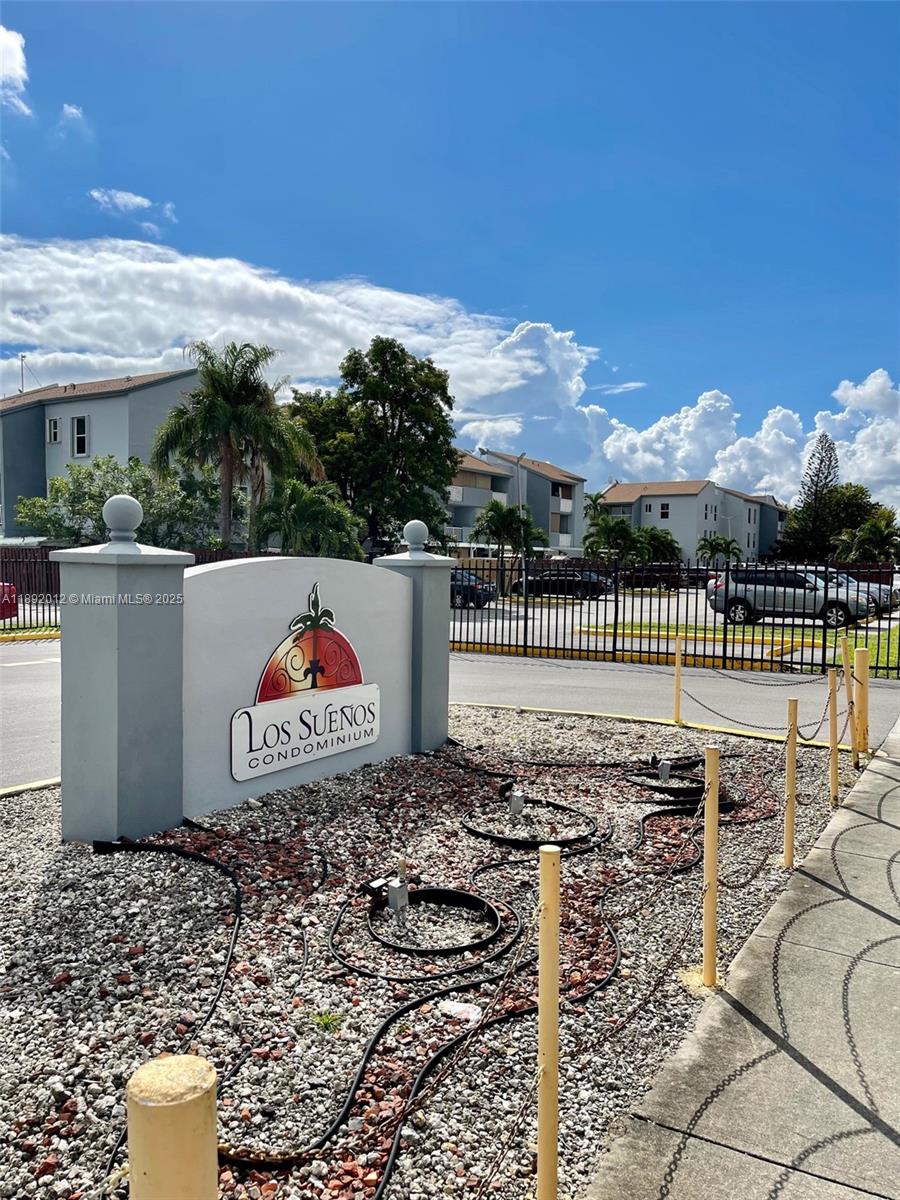 1725 West 60th Street, Unit F304 Hialeah, FL 33012 - Photo 2 of 26 a view of a terrace with a bench
