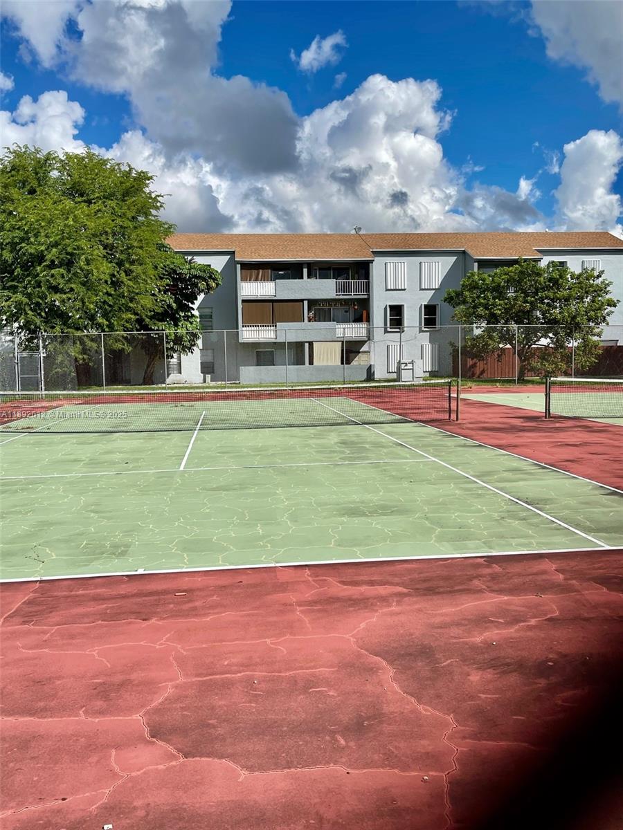 1725 West 60th Street, Unit F304 Hialeah, FL 33012 - Photo 26 of 26 a view of a big yard next to a building