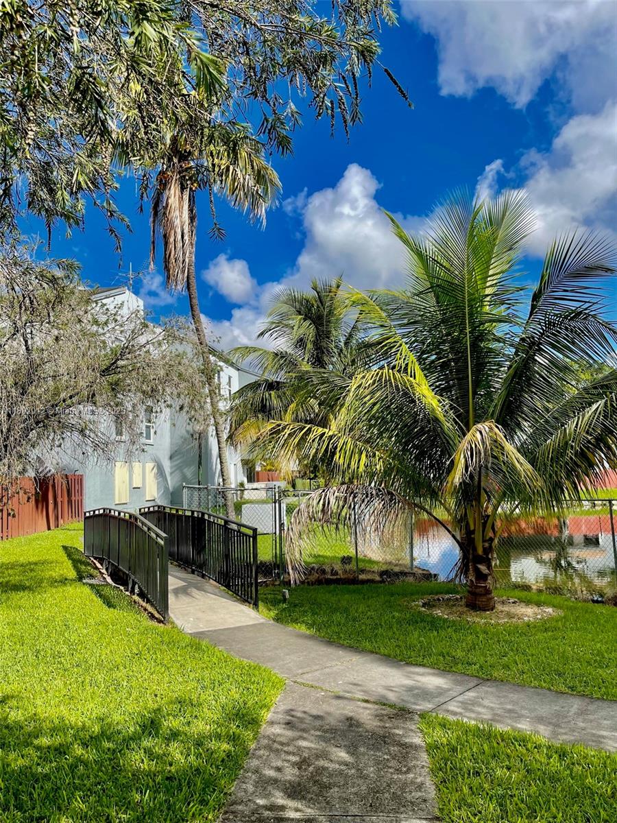1725 West 60th Street, Unit F304 Hialeah, FL 33012 - Photo 4 of 26 a view of a yard with a fountain