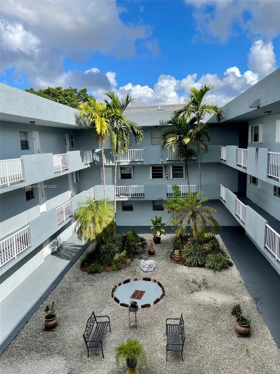 1725 West 60th Street, Unit F304 Hialeah, FL 33012 - Photo 7 of 26 a store room with furniture and a potted plant