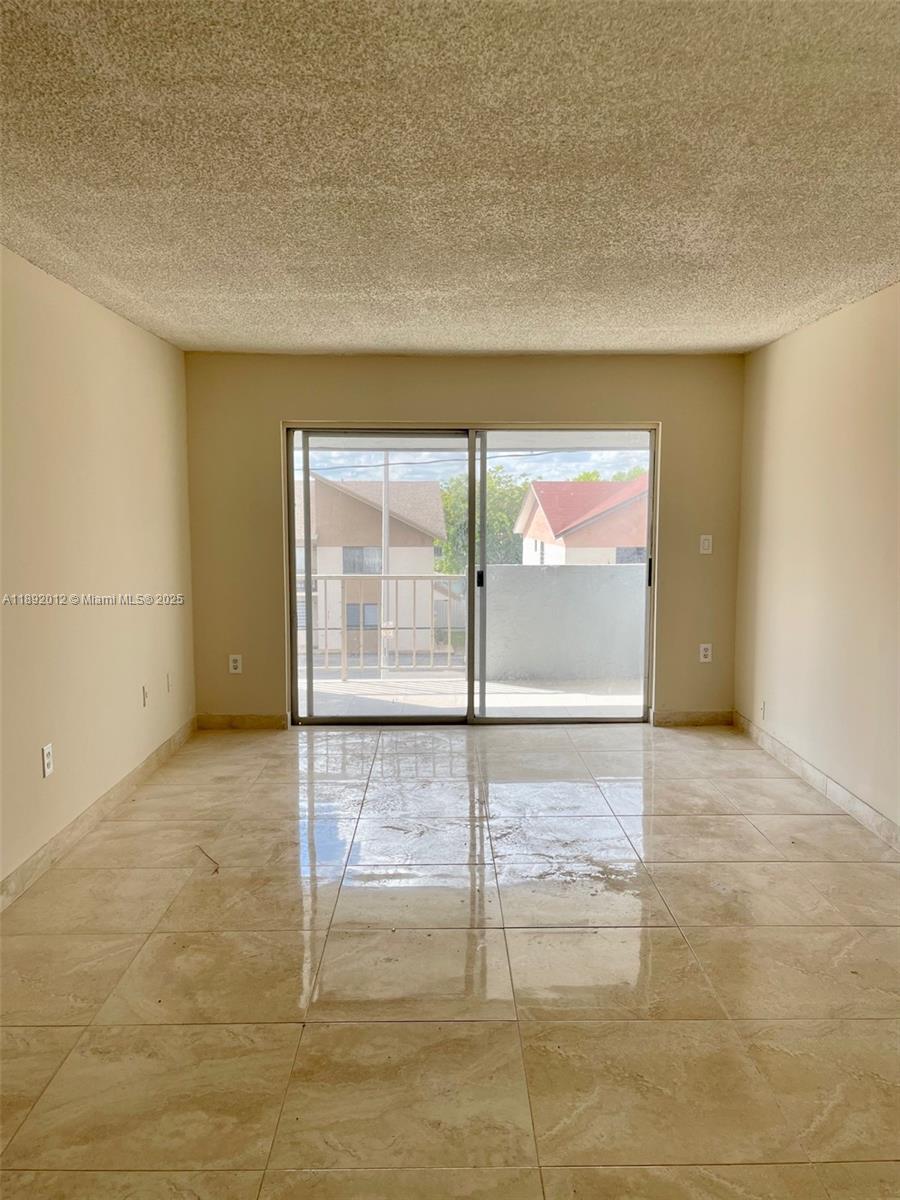 1725 West 60th Street, Unit F304 Hialeah, FL 33012 - Photo 8 of 26 a view of an empty room