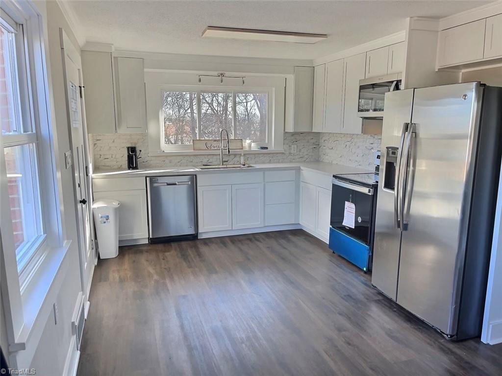 2840 Michael Road Lexington, NC 27295 - Photo 13 of 22 Kitchen with stainless steel appliances.... Including fridge.