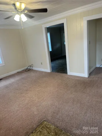 an empty room with a bathroom