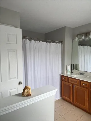 a bathroom with a sink a vanity and a tub