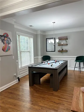 a living room with furniture and a table