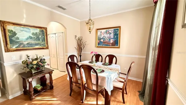 a view of a dining room with furniture window and outside view