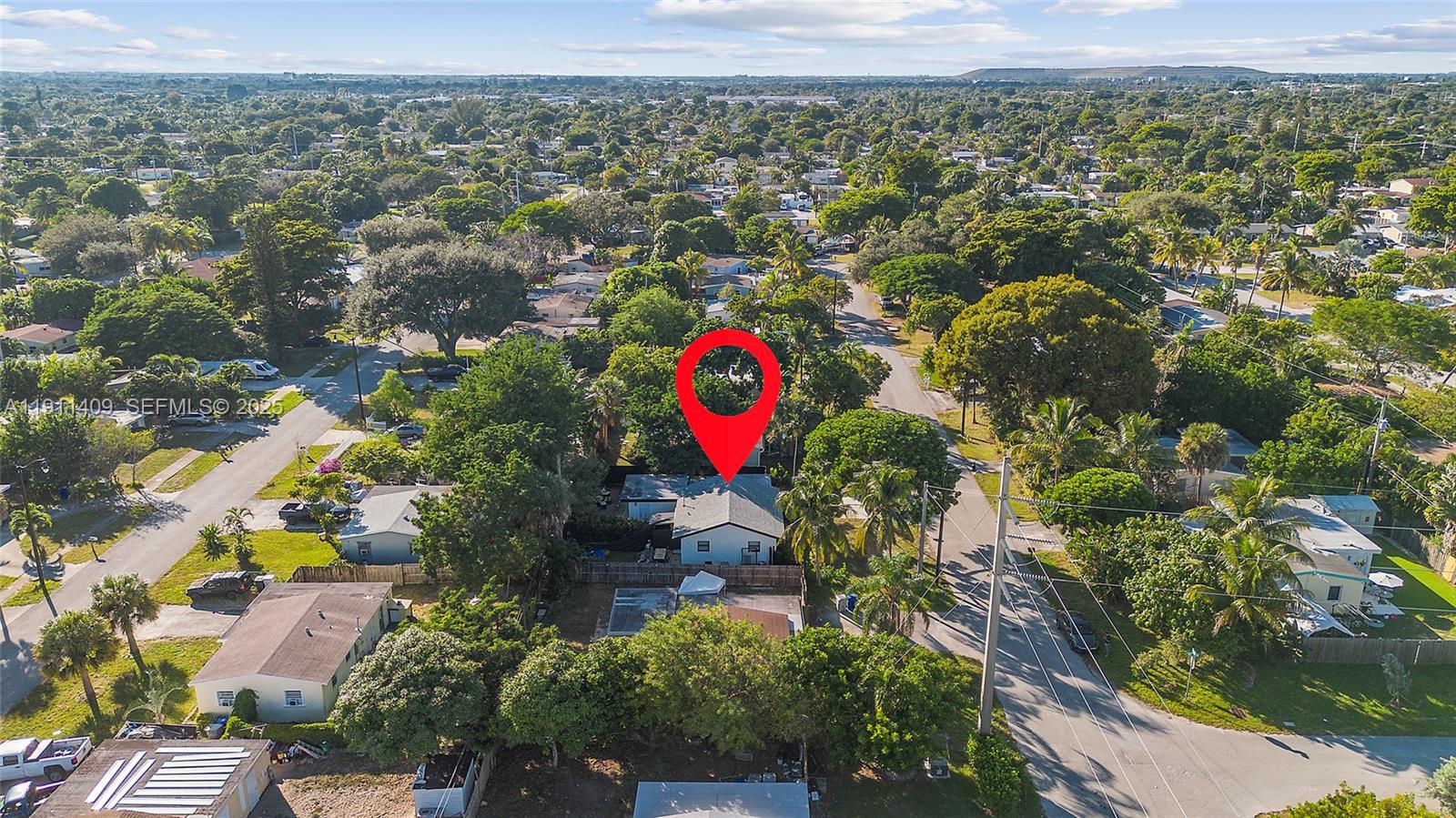 1464 Northeast 28th Street Pompano Beach, FL 33064 - Photo 50 of 51 an aerial view of residential house with outdoor space and swimming pool
