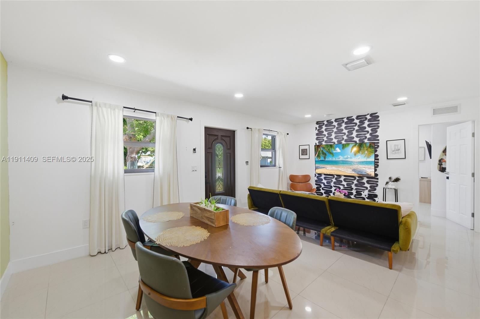 1464 Northeast 28th Street Pompano Beach, FL 33064 - Photo 8 of 51 a view of a dining room with furniture