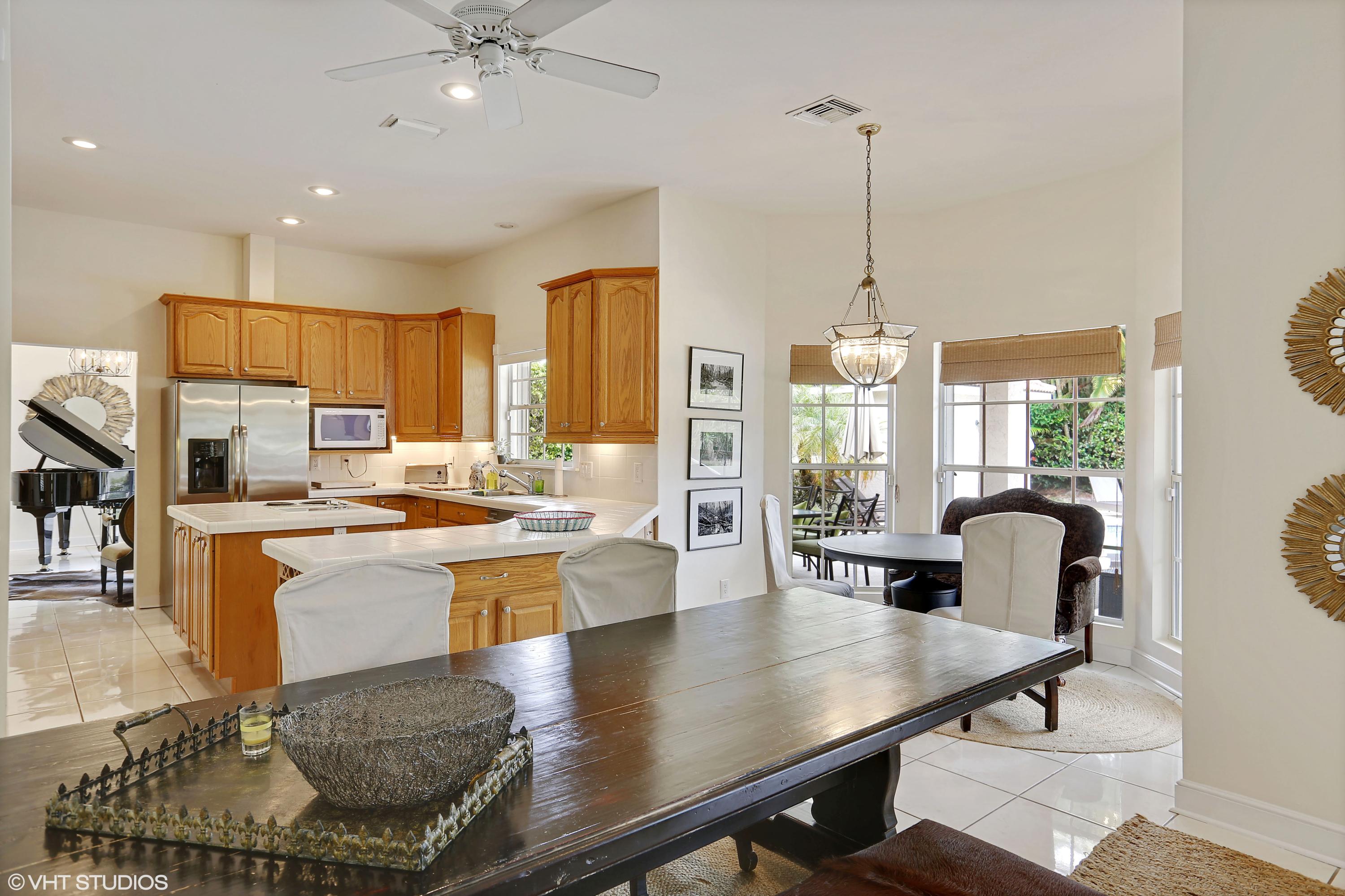 2235 Rabbit Hollowe Circle Delray Beach, FL 33445 - Photo 12 of 43 02_2235RabbitHollowCt_92_KitchenDiningRo
