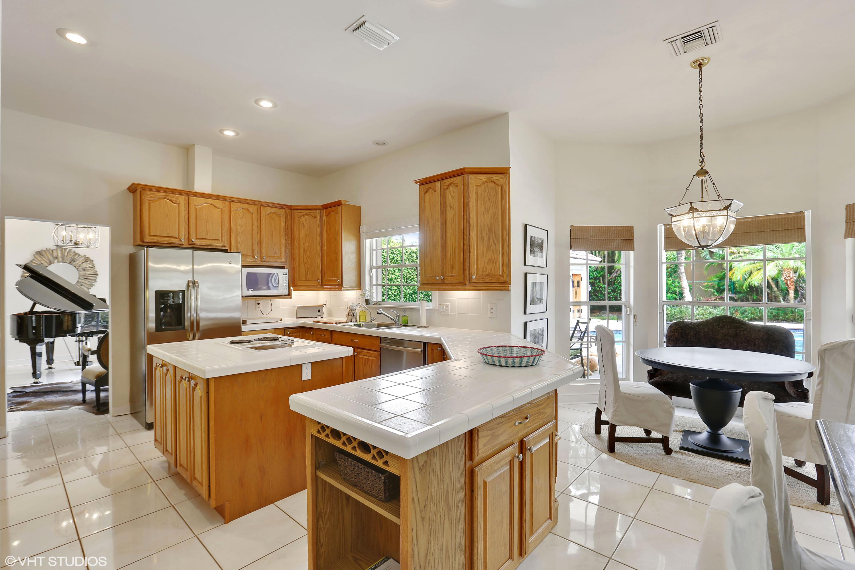 2235 Rabbit Hollowe Circle Delray Beach, FL 33445 - Photo 13 of 43 03_2235RabbitHollowCt_191_KitchenBreakfa