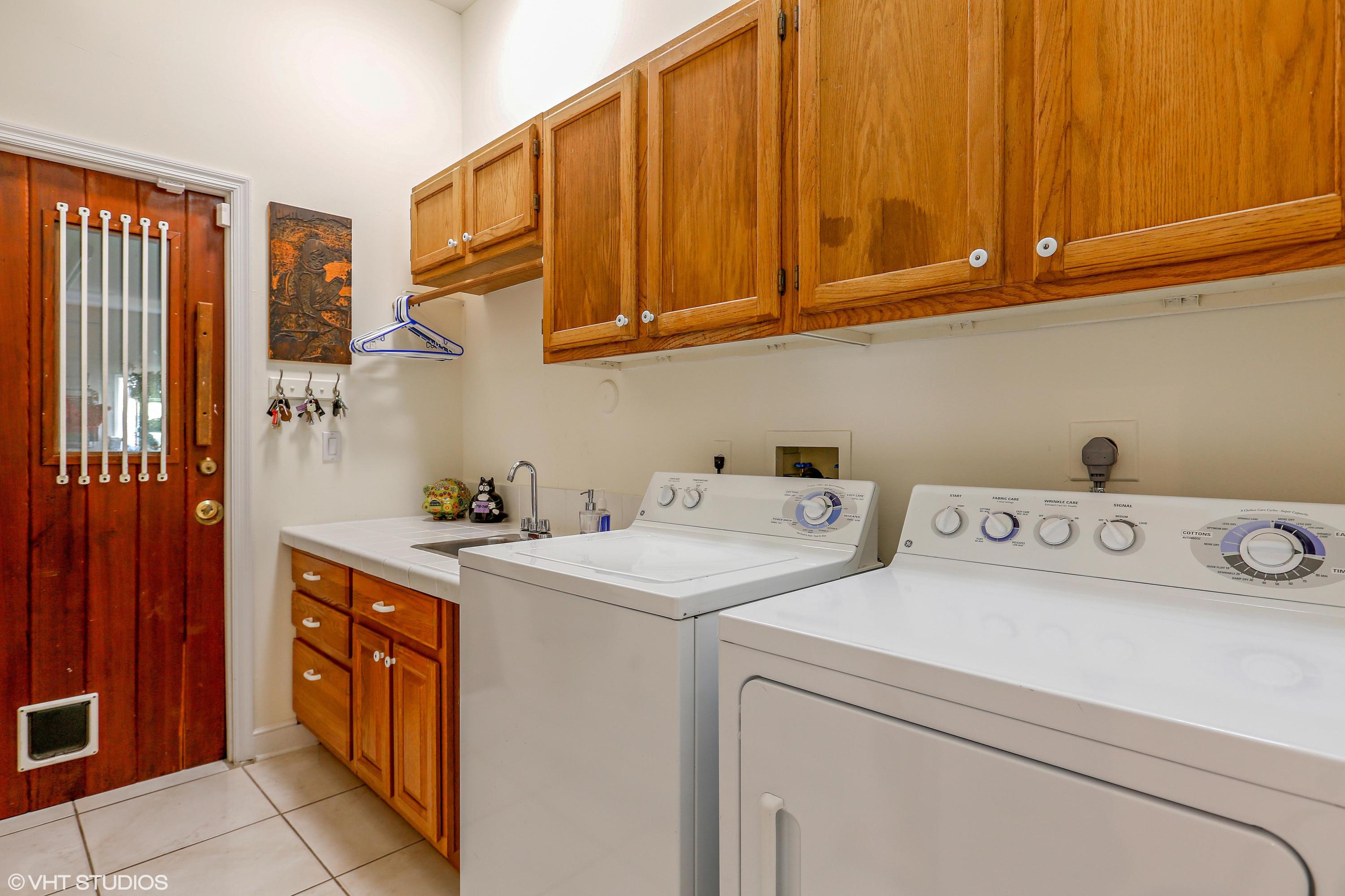 2235 Rabbit Hollowe Circle Delray Beach, FL 33445 - Photo 25 of 43 16_2235RabbitHollowCt_44_LaundryRoom_HiR