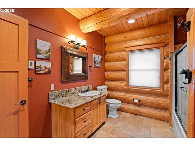 a bathroom with a sink a mirror and a bathtub