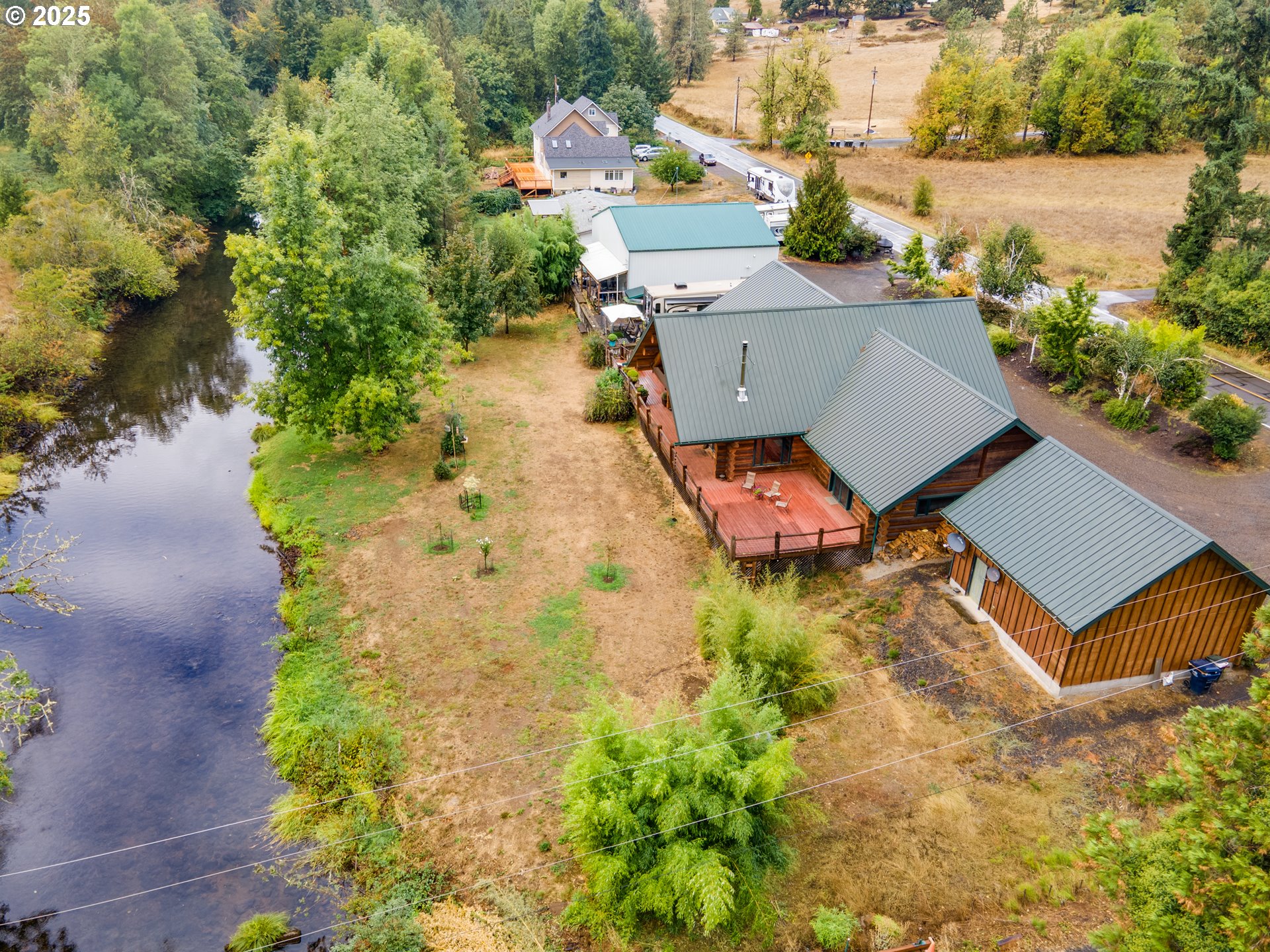 39582 Little Fall Creek Road Fall Creek, OR 97438 - Photo 2 of 44 an aerial view of a house with a garden and swimming pool