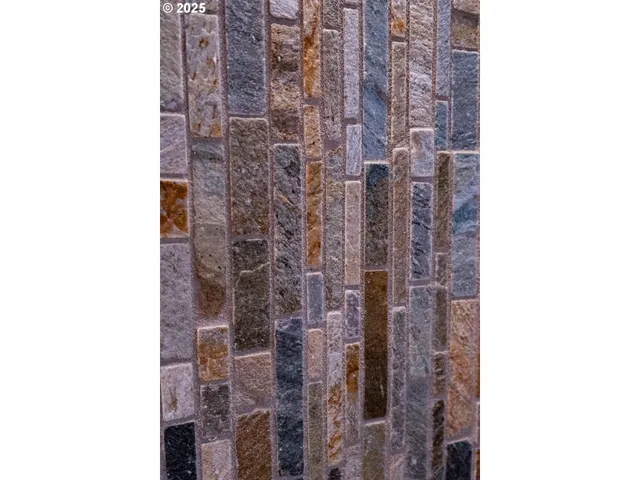 a bathroom with a shower and a sink